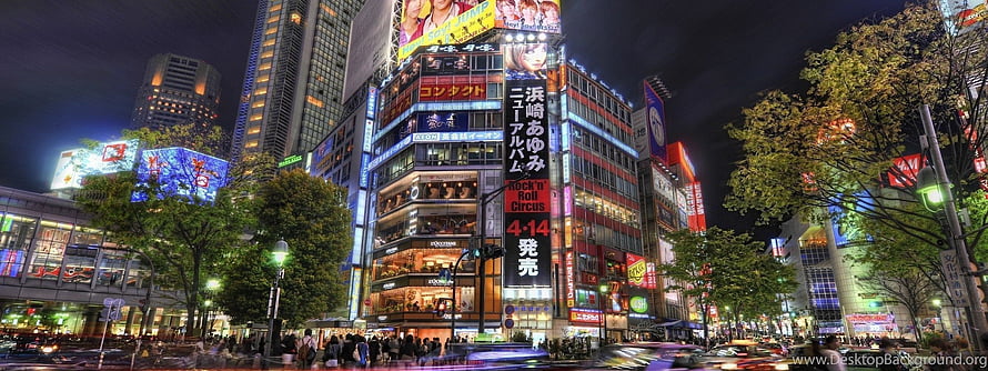 Tokyo Cityscape at Night with Vibrant Neon Signs and Busy Streets HD wallpaper