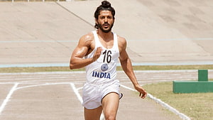 Milkha Singh Sprinting on Track in White India Athletics Uniform HD wallpaper