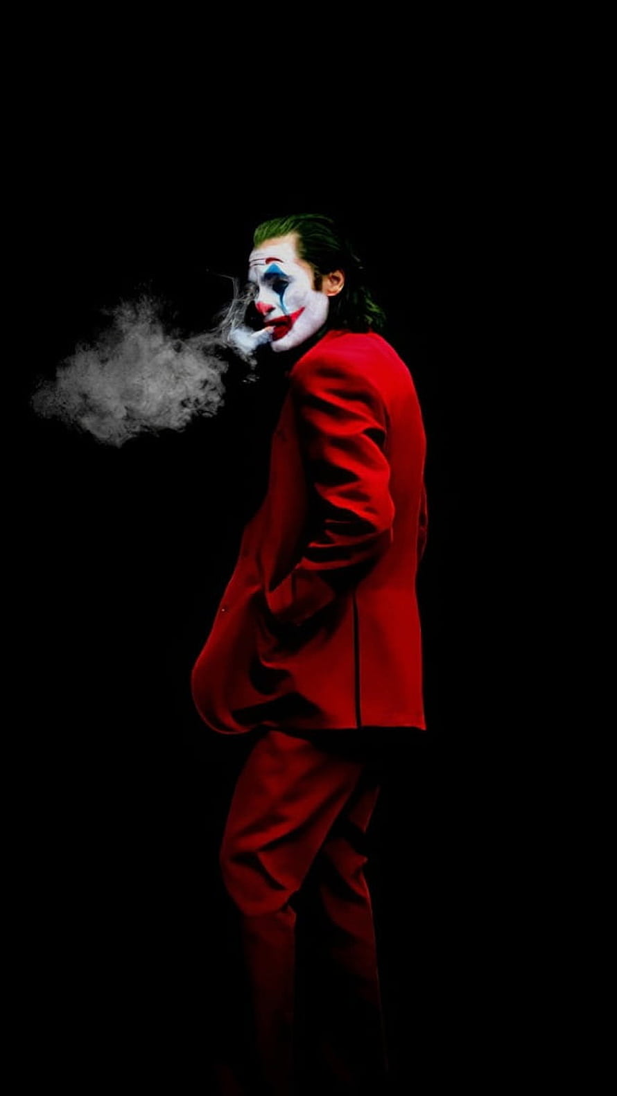 Joker in Red Suit Smoking Cigarette Against Black Background HD phone wallpaper
