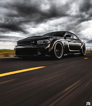 Black Dodge Charger Scat Pack Widebody Speeding on Open Road Under Stormy Sky HD phone wallpaper
