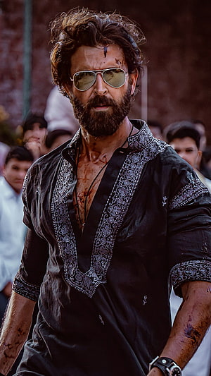 Hrithik Roshan as Baaghi 4 Character in Black Kurta with Sunglasses and Blood Stains HD phone wallpaper