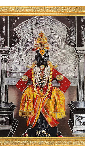Ornate Shri Vitthal Deity Portrait in Traditional Red and Gold Attire HD phone wallpaper
