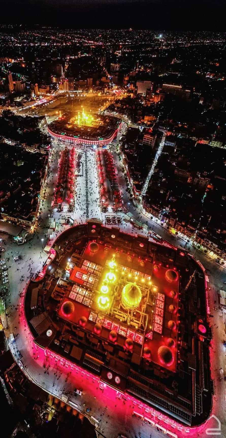 Aerial Night View of Karbala Sacred Complex with Illuminated Domes and Crowded Plaza HD phone wallpaper