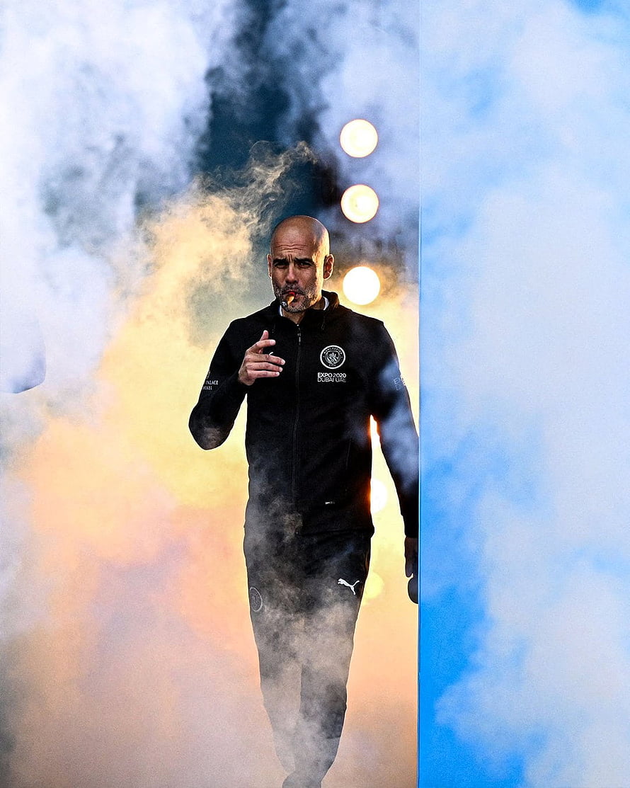 Pep Guardiola Walking Through Dramatic Smoke and Stadium Lights HD phone wallpaper