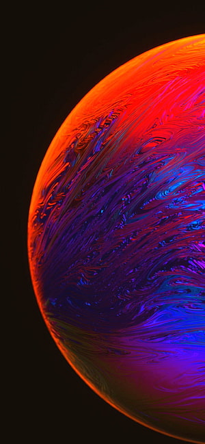 Abstract Swirling Planet With Vibrant Red, Purple, And Blue Liquid Textures On Black Background HD phone wallpaper