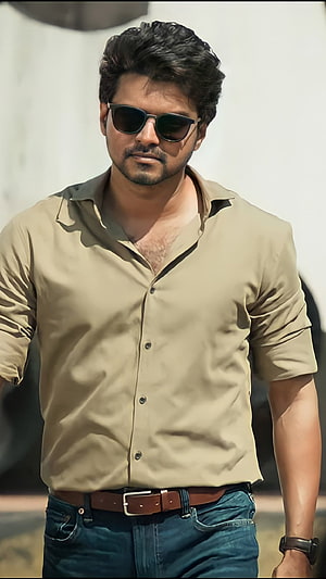Allu Arjun in a stylish beige shirt and sunglasses, exuding confidence and charisma in a casual yet fashionable look HD phone wallpaper