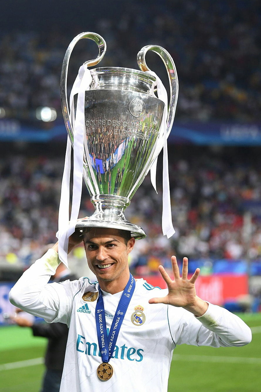 Cristiano Ronaldo Celebrating with the Champions League Trophy in Real Madrid Kit HD phone wallpaper