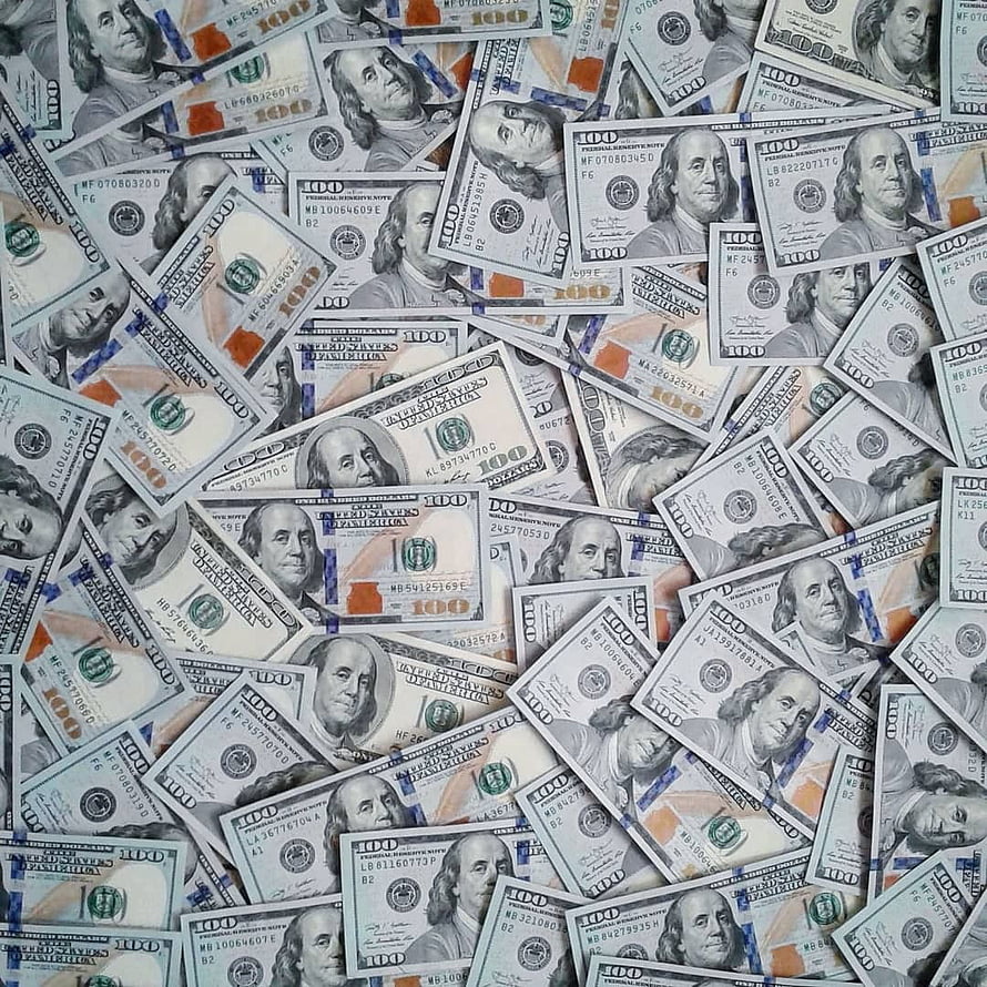 Scattered pile of one hundred dollar bills with Benjamin Franklin portraits HD phone wallpaper