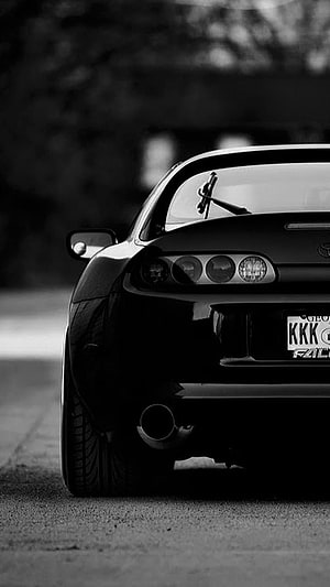 Black and White Rear View of a Toyota Supra Mk4 with JDM Aesthetic HD phone wallpaper