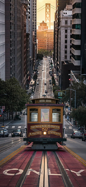 San Francisco Cable Car on Market Street with Bay Bridge at Sunset HD phone wallpaper