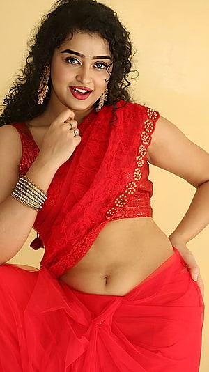Elegant Portrait of a Woman in a Vibrant Red Saree with Traditional Jewelry, Telugu actress, navel, saree beauty, red saree HD phone wallpaper