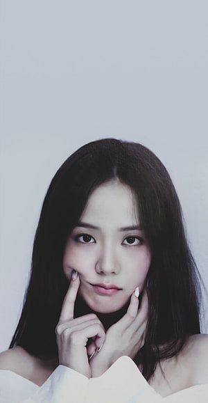 Jisoo from Blackpink in a soft studio portrait with hands framing her face HD phone wallpaper