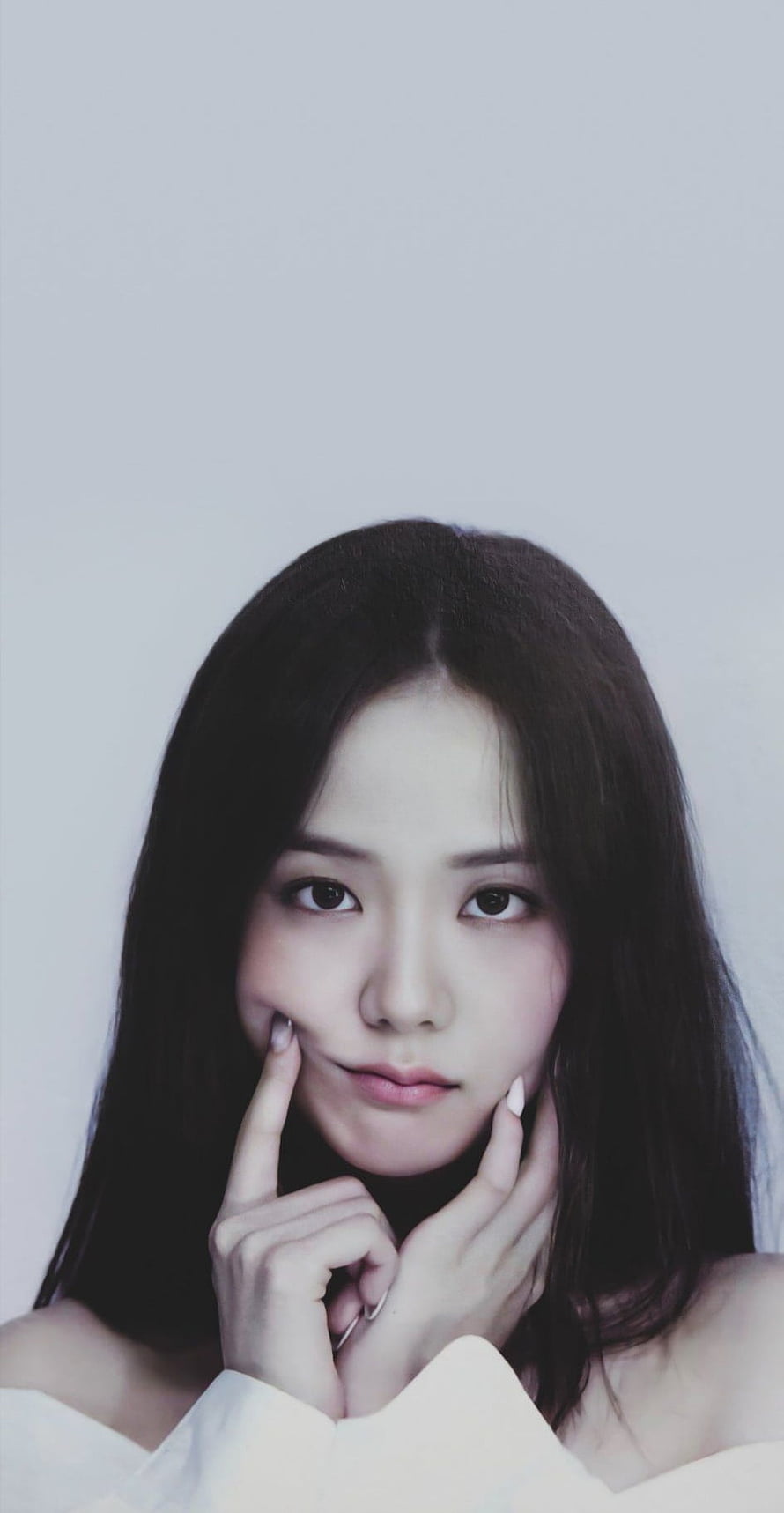 Jisoo from Blackpink in a soft studio portrait with hands framing her face HD phone wallpaper