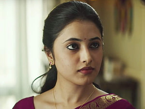 Priyanka Arul Mohan in a Maroon Saree with Gold Border and Traditional Earrings HD wallpaper