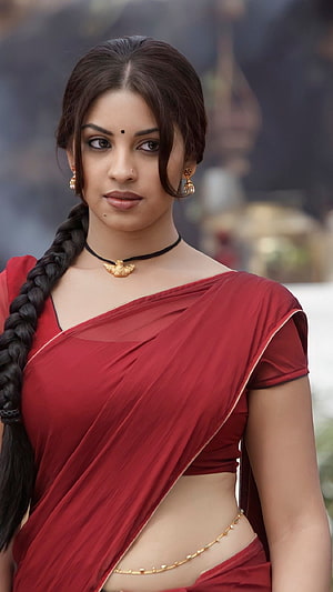 Portrait of a woman in a red saree with a long braid and gold jewelry, Richa Gangopadhyay, osthi, tamil movie HD phone wallpaper