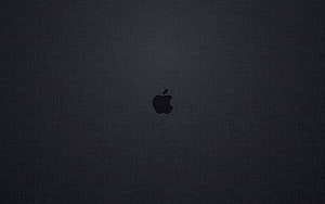 Minimalist Dark Apple Logo on Textured Fabric Background HD wallpaper