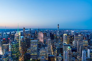 Aerial View of New York City Skyline at Dusk with Illuminated Skyscrapers HD wallpaper