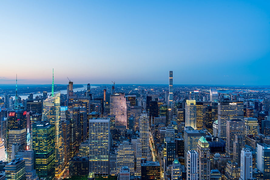 Aerial View of New York City Skyline at Dusk with Illuminated Skyscrapers HD wallpaper