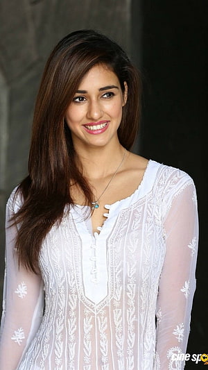Disha Patani smiling portrait wearing a white embroidered kurta with sheer sleeves HD phone wallpaper