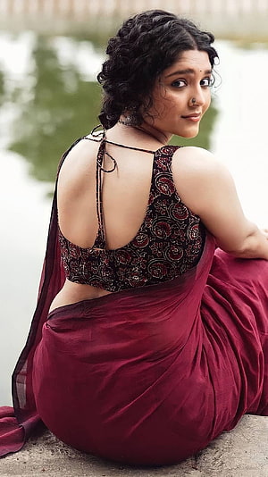 Rashmika Mandanna in a Maroon Saree with Floral Blouse Sitting by the Water, Rithika singh, multilingual actress, saree lover HD phone wallpaper
