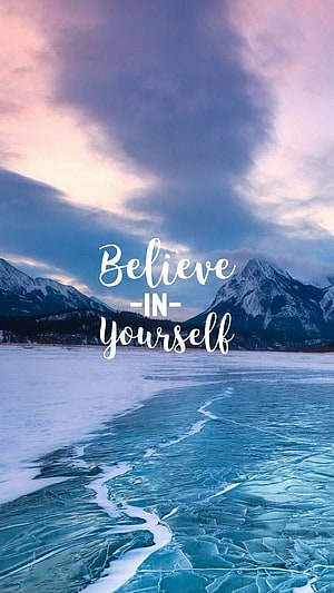 Frozen Lake and Snowy Mountains at Dusk with Inspirational Quote Overlay HD phone wallpaper