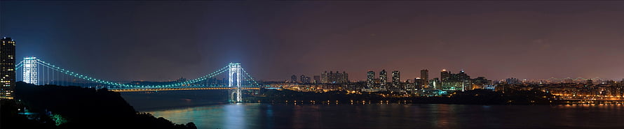New York City Skyline and Bridge at Night with Water Reflections HD wallpaper