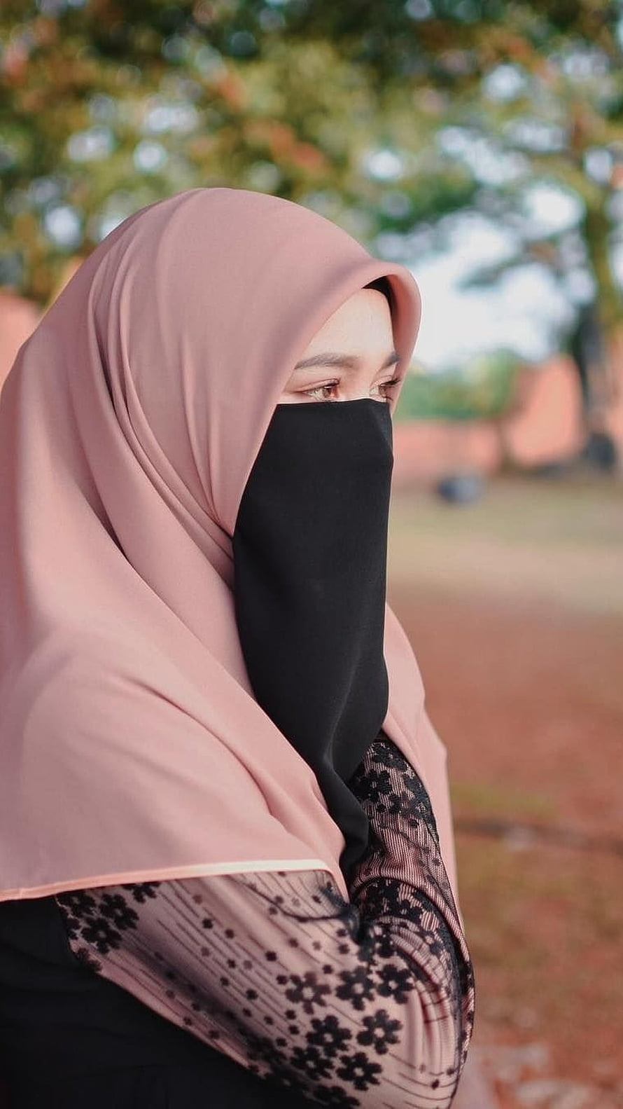 Portrait of a woman wearing a pink hijab and black niqab with floral lace sleeves outdoors, Muslim Girl , Glamorous Hijab HD phone wallpaper