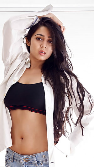 Adah Sharma in a white shirt and black top posing with long wavy hair HD phone wallpaper