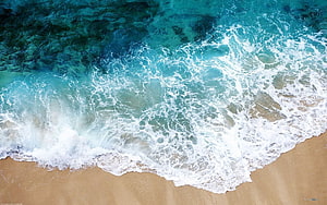 Aerial View of Turquoise Ocean Waves Crashing on Sandy Beach HD wallpaper