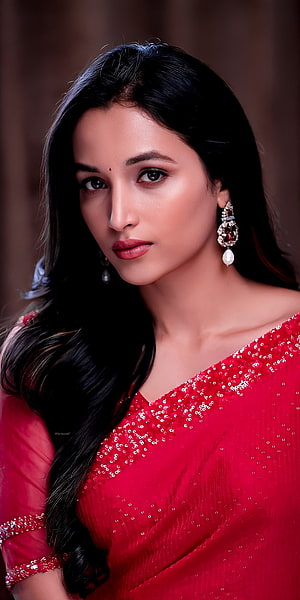 Kiara Advani in a stunning red sequined saree with elegant jewelry and long dark hair HD phone wallpaper