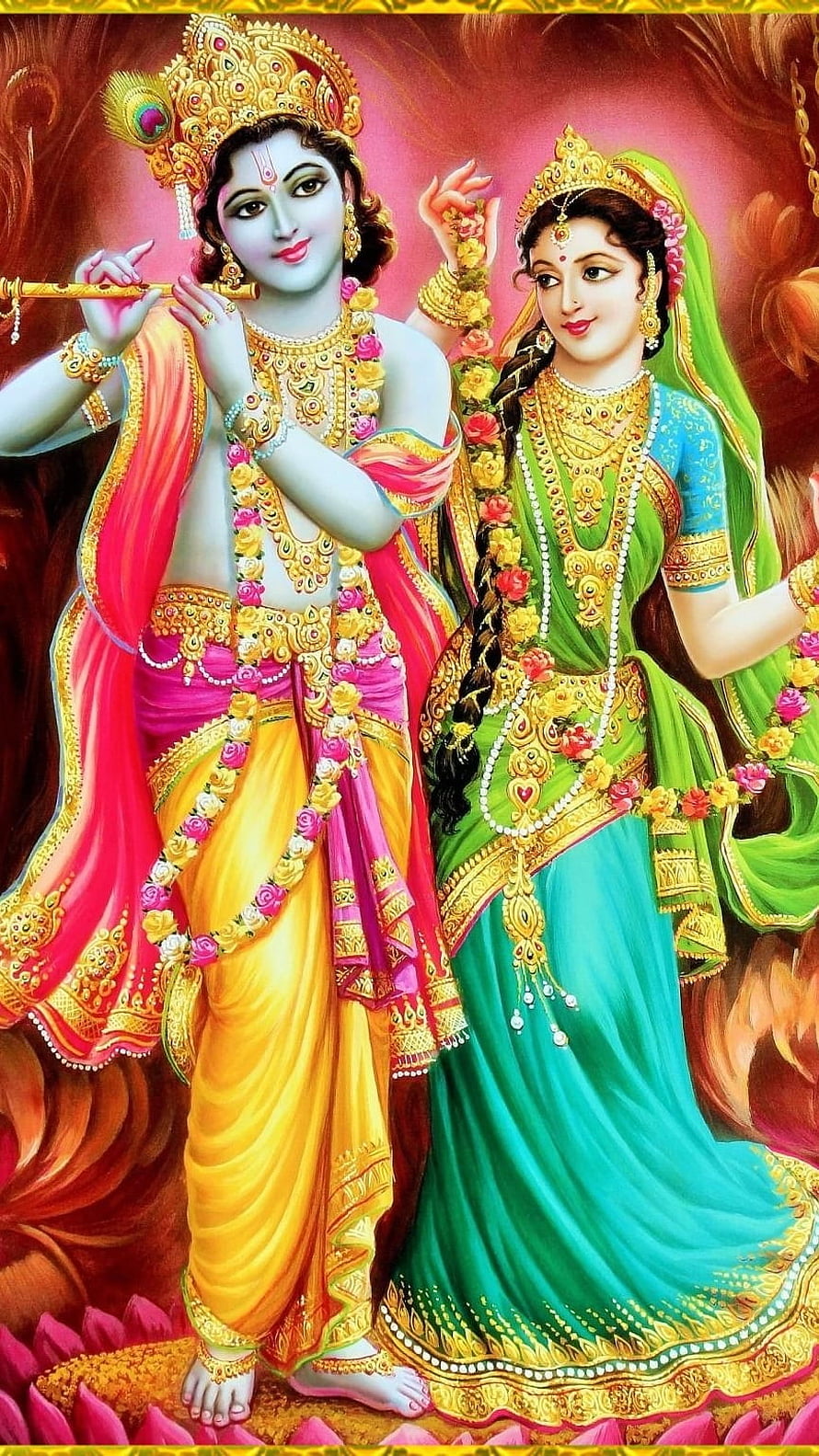 Radha Krishna Divine Portrait in Traditional Indian Attire with Flute and Floral Garlands HD phone wallpaper