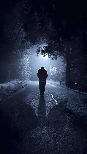 Lonely Hooded Figure Walking Down A Dark Foggy Road At Night HD phone wallpaper