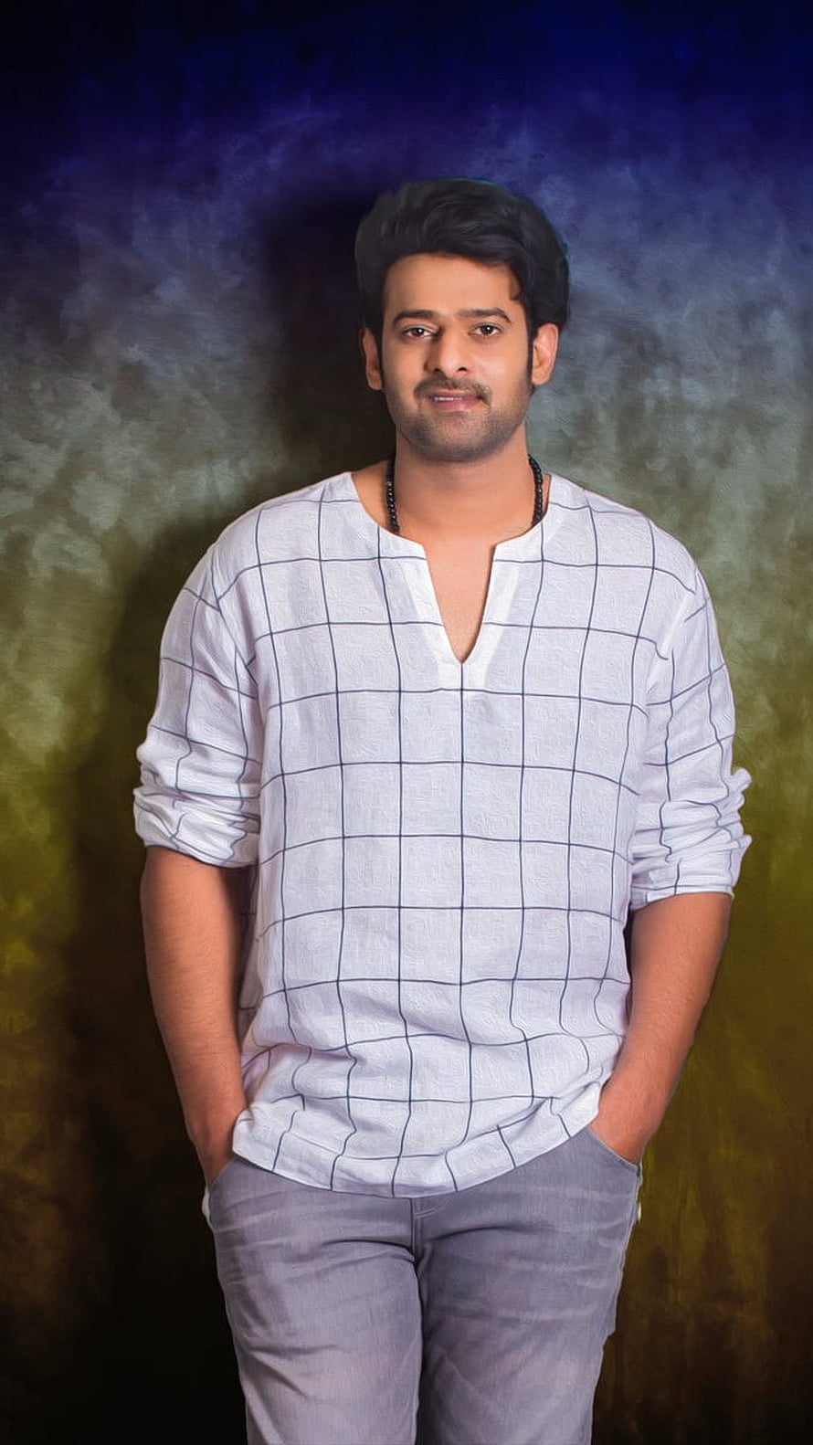 Portrait of Indian Actor Parthiepan in a White Checkered Shirt and Grey Jeans HD phone wallpaper