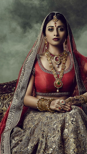 Elegant Indian Bride in Red Lehenga with Traditional Gold Jewelry and Henna HD phone wallpaper