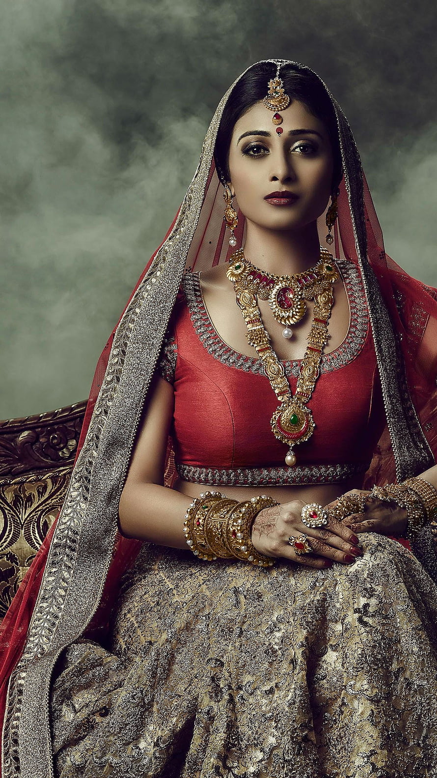 Elegant Indian Bride in Red Lehenga with Traditional Gold Jewelry and Henna HD phone wallpaper