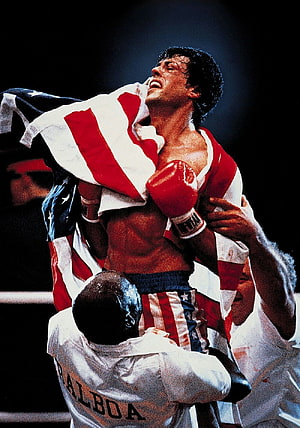Rocky Balboa Draped in American Flag After Victory in the Boxing Ring HD phone wallpaper
