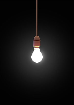 Glowing Incandescent Light Bulb Hanging on Cord Against Black Background HD phone wallpaper