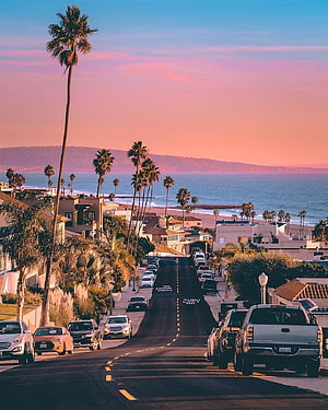 Santa Barbara California Coastal Street at Sunset with Palm Trees and Ocean View HD phone wallpaper