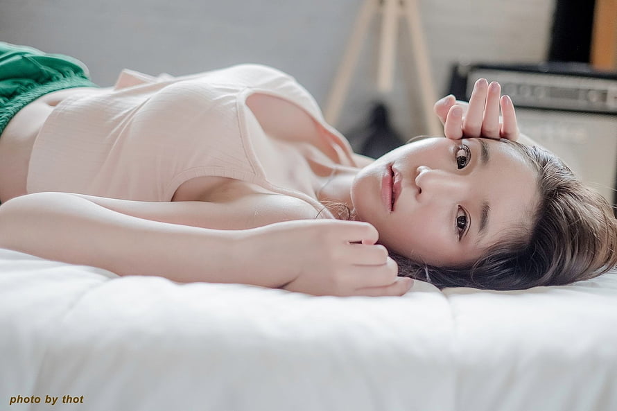 Young Asian Woman Lying on White Bed with Soft Natural Lighting, Asian, women, girl, model HD wallpaper