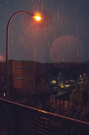 Moody Urban Night Scene With Glowing Street Lamp And Heavy Rainfall HD phone wallpaper