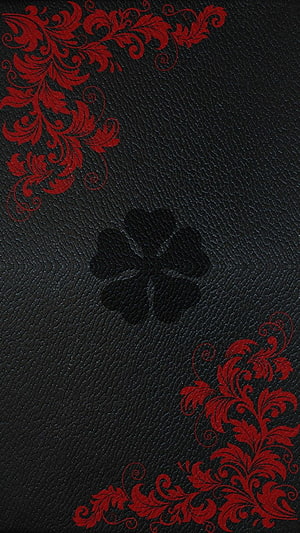 Black Leather Texture With Red Floral Corner Ornaments And Embossed Clover Center HD phone wallpaper