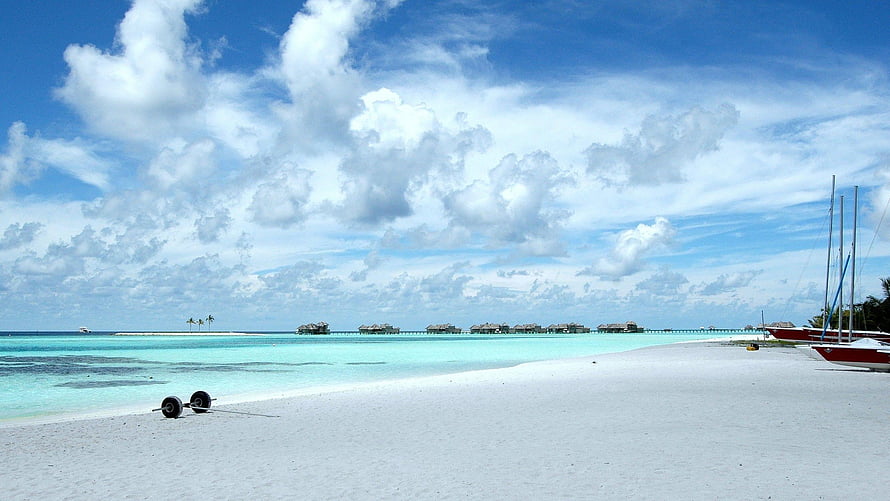 Tropical Island Beach With Overwater Bungalows And Turquoise Lagoon HD wallpaper
