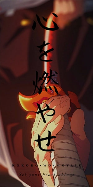 Rengoku Kyojuro Holding His Glowing Nichirin Blade in Demon Slayer HD phone wallpaper
