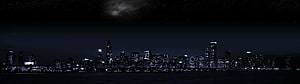 Chicago Skyline at Night with Moonlit Clouds and Lakefront Reflections HD wallpaper