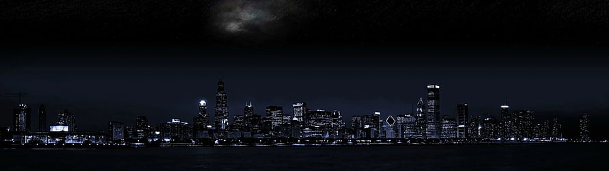 Chicago Skyline at Night with Moonlit Clouds and Lakefront Reflections HD wallpaper
