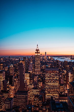 New York City Skyline at Dusk Featuring the Empire State Building and Manhattan Skyline HD phone wallpaper