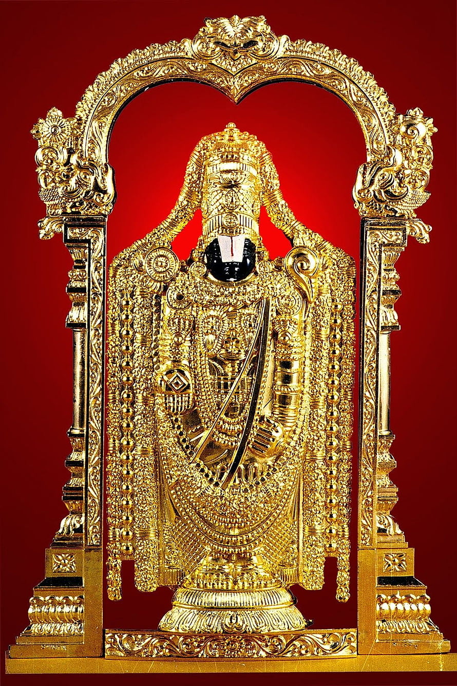 Ornate Gold Venkateswara Swamy Murti with Intricate Temple Arch on Red Background HD phone wallpaper