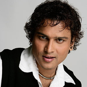Zubeen Garg Studio Portrait in Black Vest and White Shirt HD phone wallpaper