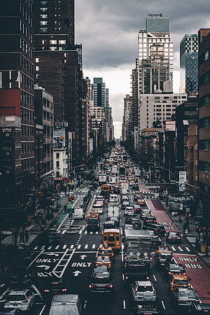 Aerial View of Heavy Traffic on a Busy New York City Avenue Under an Overcast Sky HD phone wallpaper