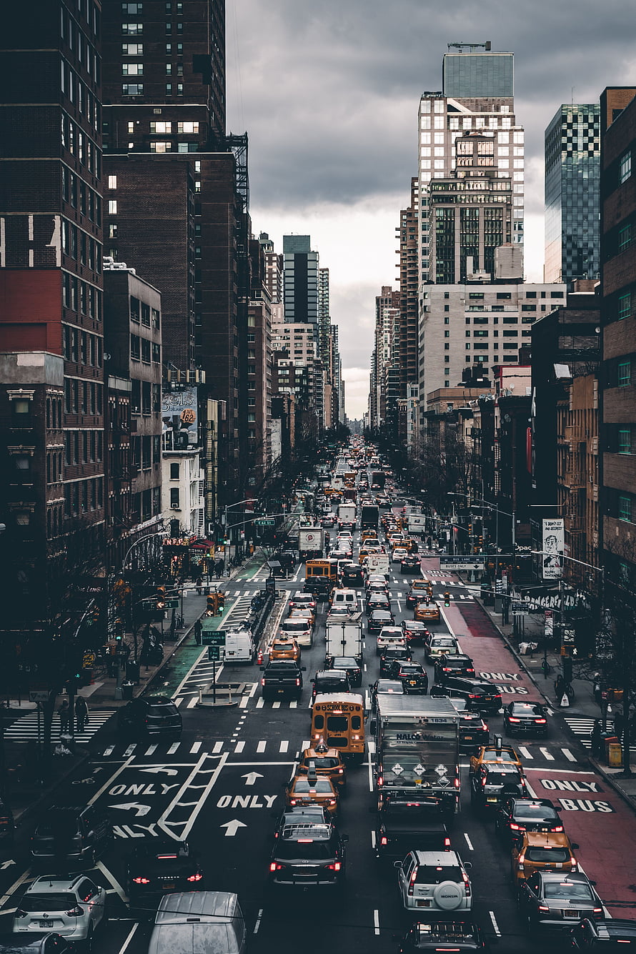 Aerial View of Heavy Traffic on a Busy New York City Avenue Under an Overcast Sky HD phone wallpaper